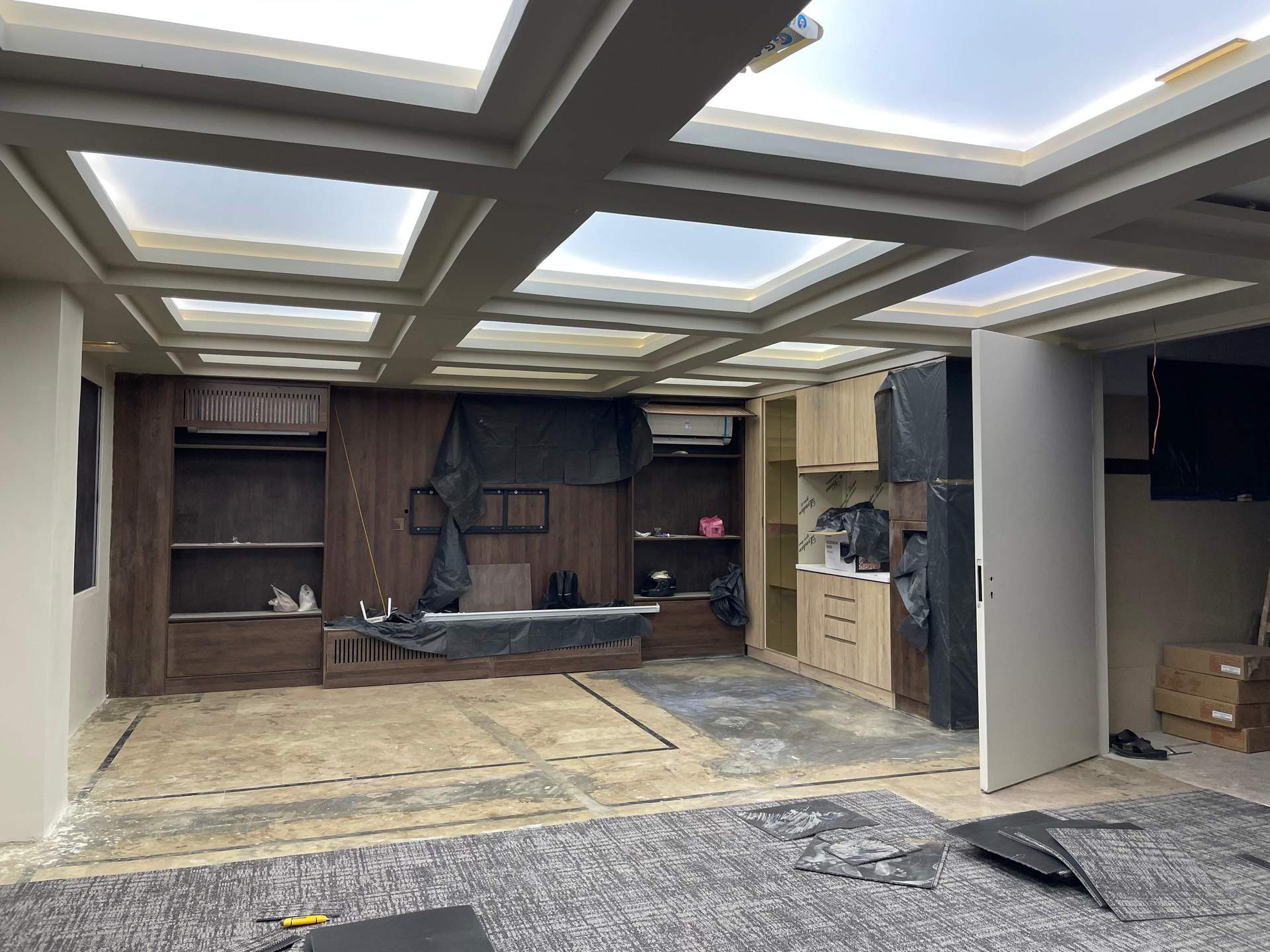 Completed committee room with coffered ceiling and cove lighting